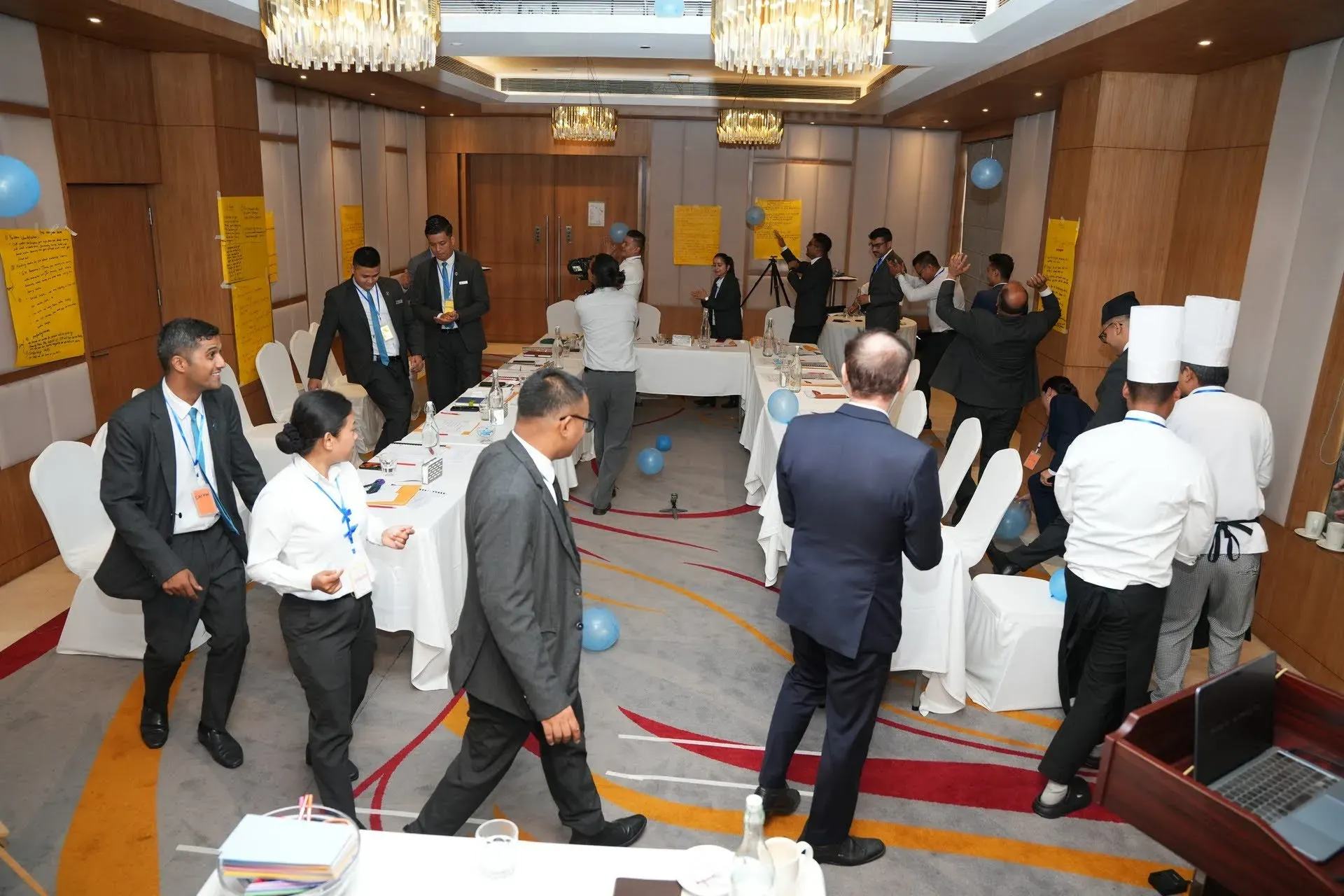 Participants up and dancing during a group exercise in the seminar room.