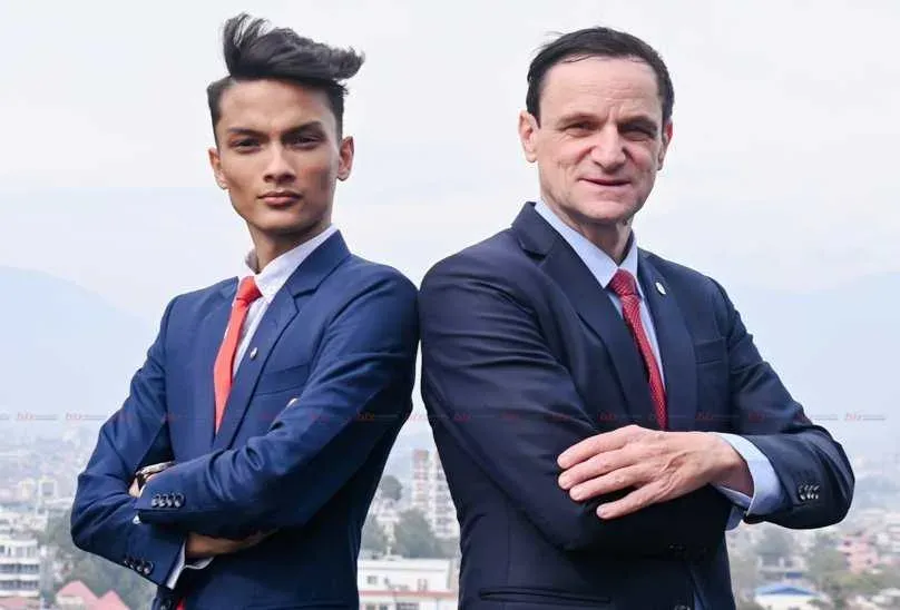 Kovid Panthy and Kim Baaden standing back to back above the Kathmandu valley.